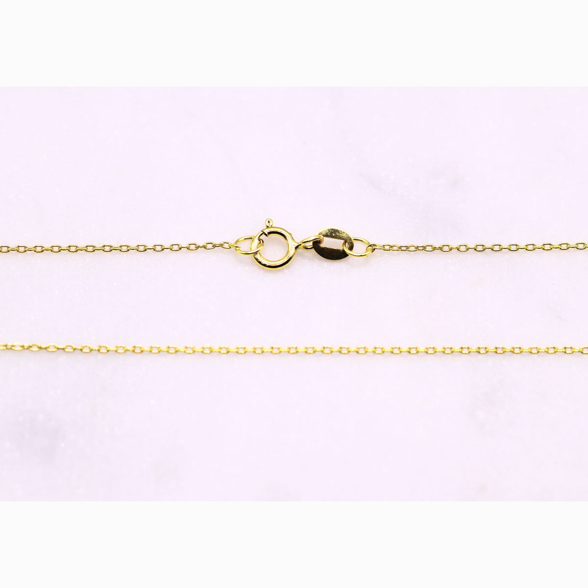 Anker schakelketting 0,6 mm 14k goud, detail van de sluiting
