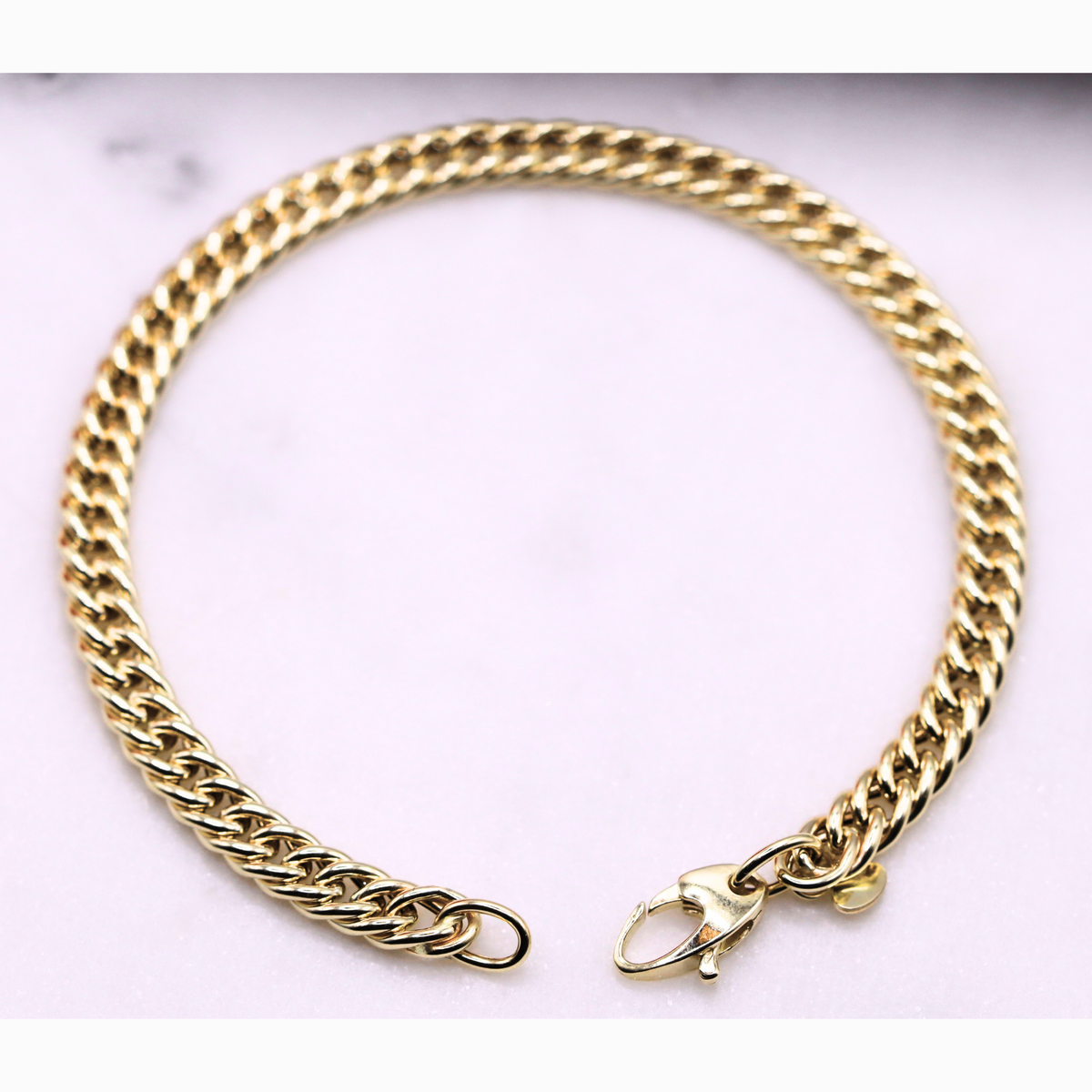 Gourmet armband dubbel 5 mm 14k goud, opengelegd met zichtbare sluiting