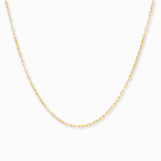Kabel schakelketting 0,75 mm 14k goud, hangend op witte achtergrond