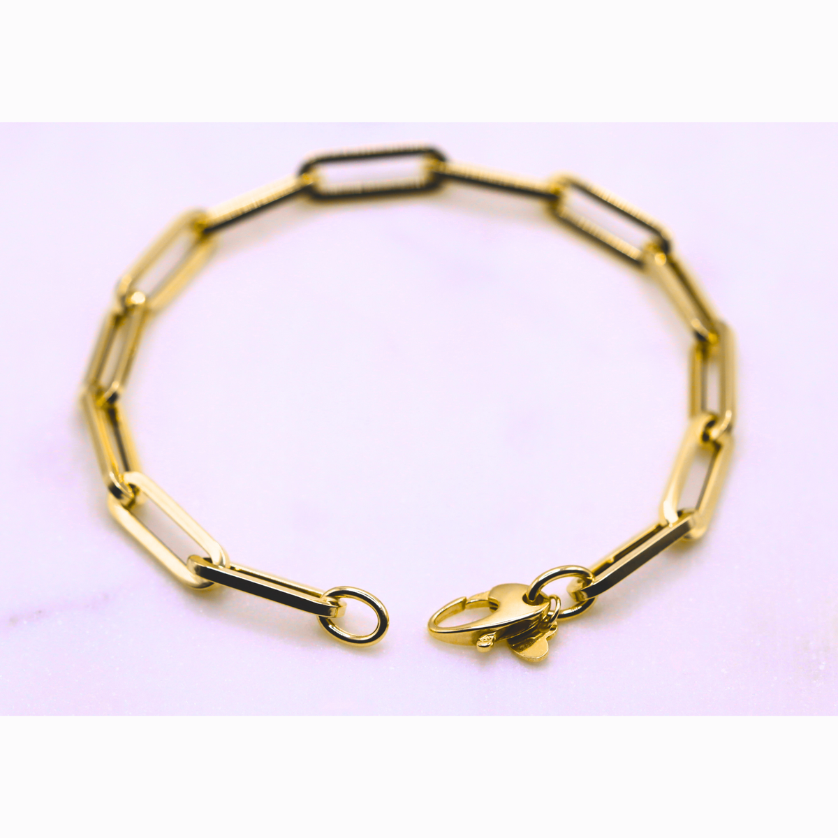 Long Paperclip Schakelarmband 5,5 mm 14k goud, opengelegd met zichtbare sluiting