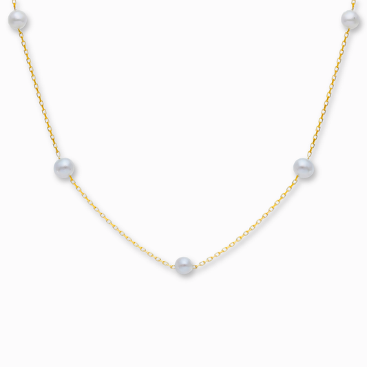 Parel ketting 14k goud, hangend op witte achtergrond