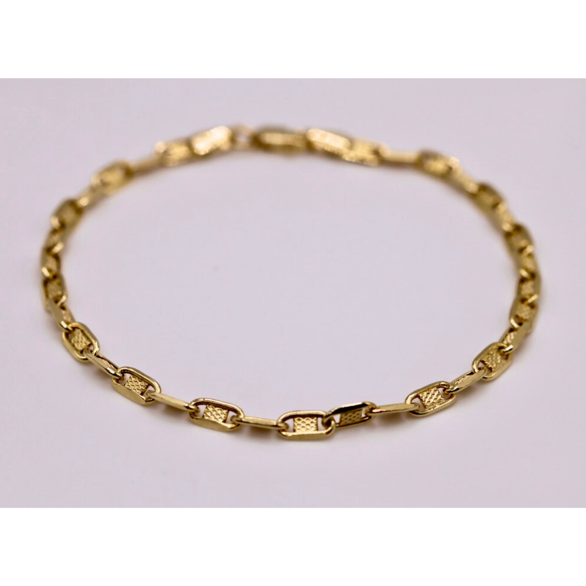 Mariner armband 3,5 mm 14k goud, productfoto in lus op witte achtergrond