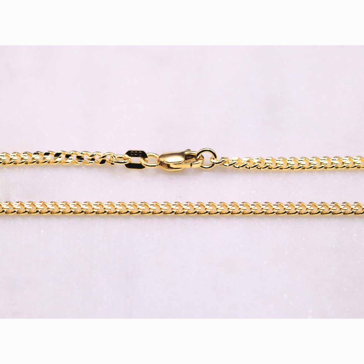 Gourmet ketting 2,5 mm 14k goud, detail van de sluiting