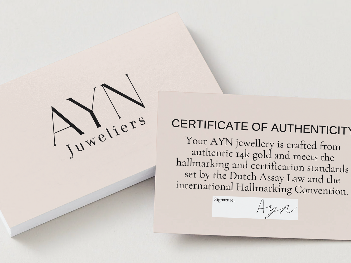 AYN Juweliers echtheidscertificaat bij Klaver armband parelmoer detail 1 mm 14k goud