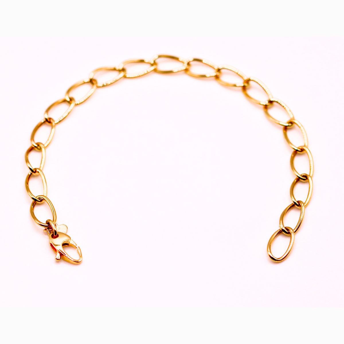 Ovale schakelarmband 6,5 mm 14k goud, opengelegd met zichtbare sluiting