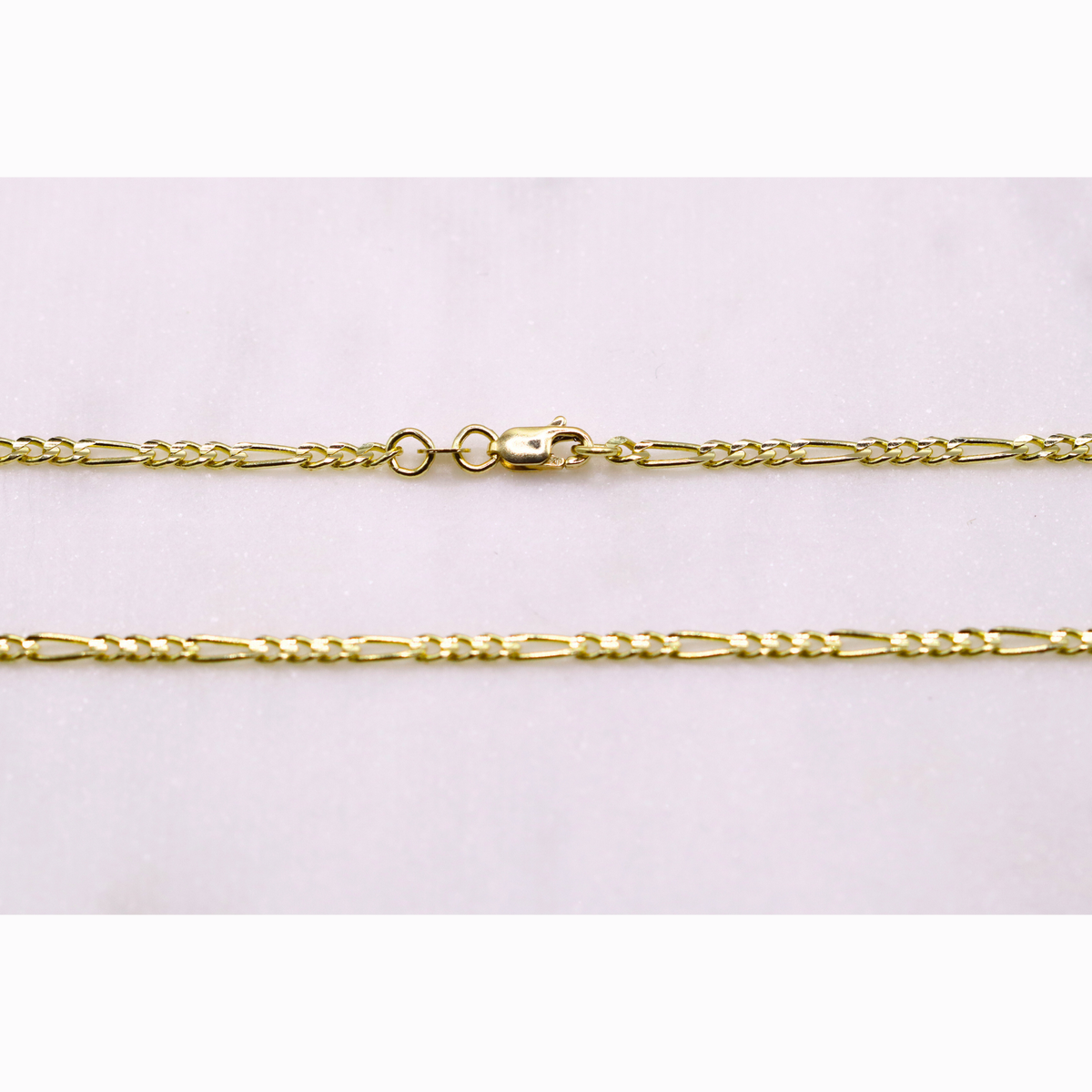 Figaro schakelketting 2,5 mm 14k goud, detail van de sluiting